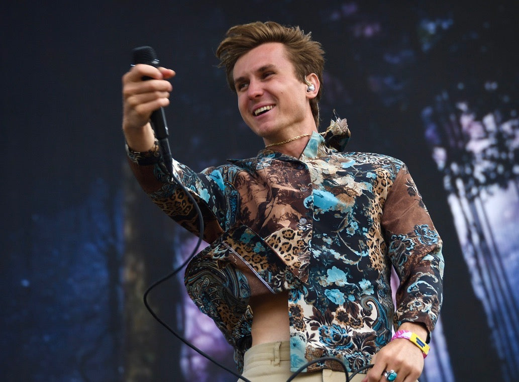 Xander Carlson of Forester wearing a Smoky Quartz onstage at Outsidelands